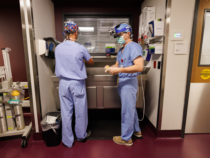 Dr. Phillip Burch, chief of pediatric cardiothoracic surgery at Children's of Mississippi, scrubs up before a procedure.