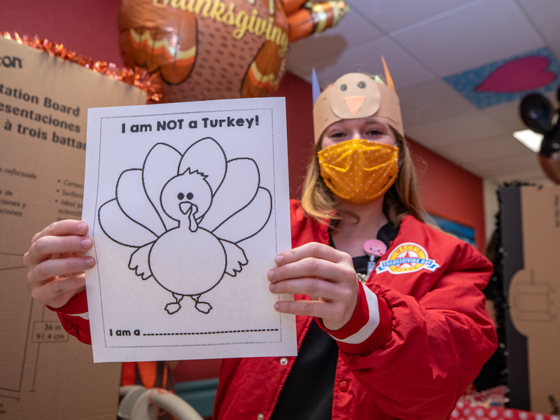 Nursing student Abbey Climer shows a Thanksgiving coloring sheet patients received during the children's hospital's Thanksgiving Parade Nov. 22.