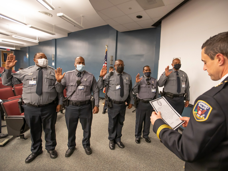 Bromen swears in patrol officers, from left, Travis Sallis, Joey Lenard, Reginald Craft, Darrell Longino and Darrel Robinson during the UMMC Police Department fall ceremony.