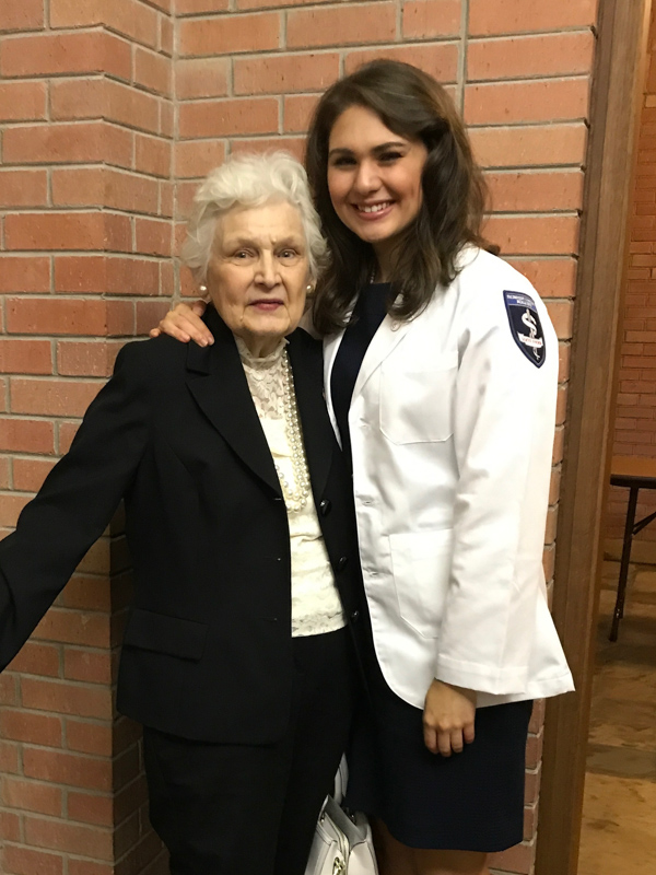 Following her White Coat Ceremony in 2017, Elizabeth Wicks celebrates with her grandmother, Marie B. Eustice, who along with Wicks' parents, has been a source of "constant encouragement and support."