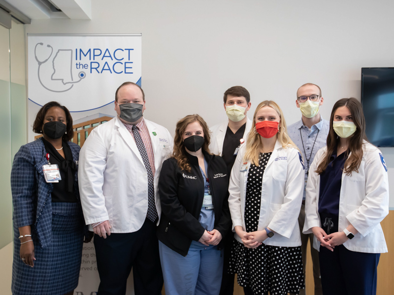 Dr. Loretta Jackson-Williams, far left, is on hand to congratulate the six scholarship awardees who were able to attend the signing ceremony. They are, from left, Daulton Newman, Leah Bowlin, Riley Alef, Lauren Billington, Christopher Turley and Olivia Grant. The other scholarship winners are Katherine Cranston and Austin Urvina.