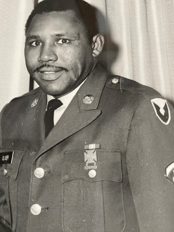 Oliver, who served in the U.S. Army, is shown here in 1967 wearing his uniform as a Specialist 5. A member of the honor guard, Oliver, who learned to play the trumpet, performed taps.