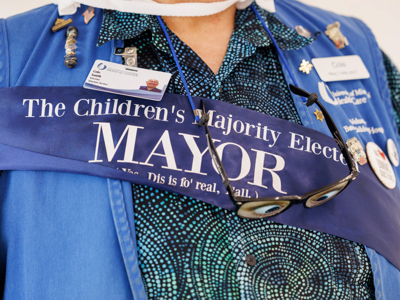 Cole Smith, the self-proclaimed Mayor of UMMC and a 15-year volunteer of the hospital, guides patients and their families through the halls of Children's of Mississippi.