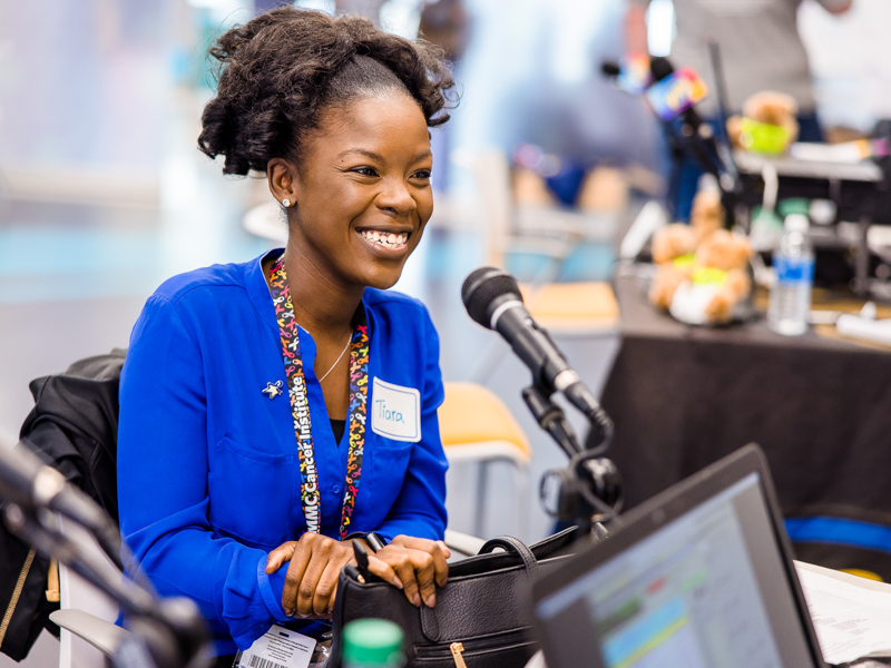 Love tells her experiences dealing with childhood cancer to radio stations during the 2022 Radiothon.