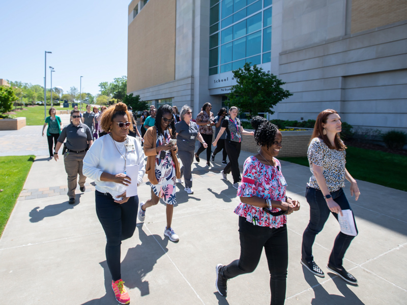 UMMC employees and students enjoyed Friday's spring weather while joining the campus National Walking Day celebration. Melanie Thortis/ UMMC Communications