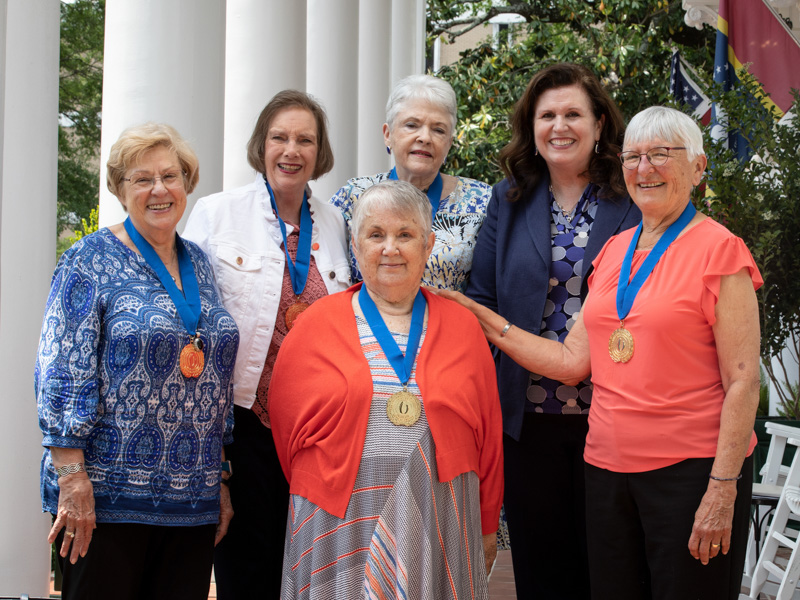 "Golden Graduates" of the SON who attended school there 50 or more years ago include, from left, Carol Ann McGehee, Priscilla Berry, Kay Jones (front center) and Sylvia Abney; and far right, Sandra West. Joining them is SON Dean Dr. Julie Sanford, second from right. Jay Ferchaud/ UMMC Communications