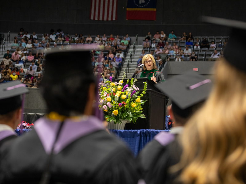 Dr. LouAnn Woodward, vice chancellor for health affairs and dean of the School of Medicine, addresses graduates during Friday's ceremony at Mississippi Coliseum. Jay Ferchaud/ UMMC Communications
