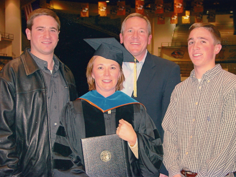 Dr. Jessica Bailey with her sons and husband after graduating with a doctorate in Educational Leadership & Policy Analysis from the University of Missouri-Columbia in 2001.