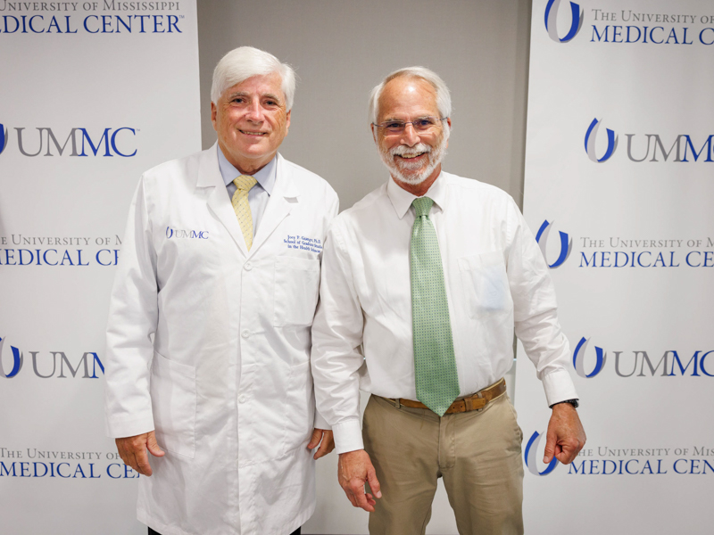 Dr. Joey Granger, left, dean of the School of Graduate Studies for the Health Sciences, said that Brown's dedication to education and mentoring made him a strong candidate for the 2022 Regions TEACH Prize. Joe Ellis/ UMMC Communications 