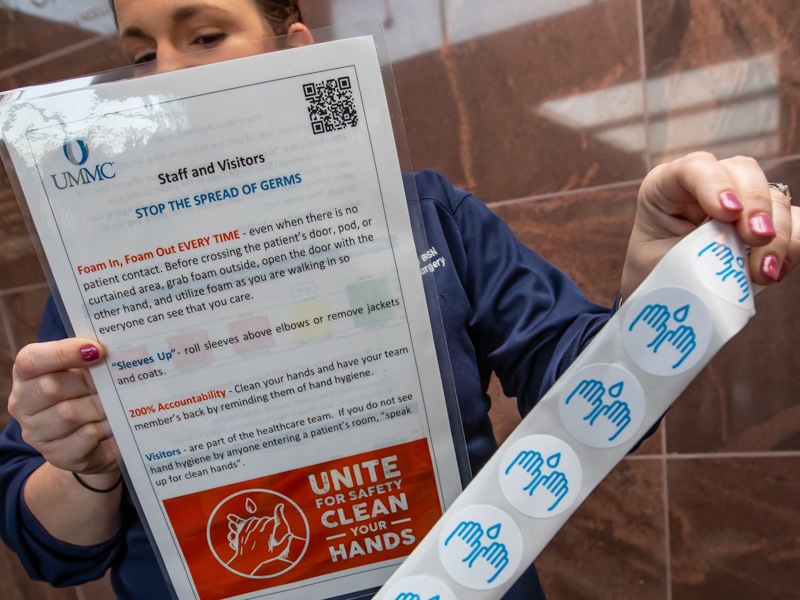 University Hospital educator and registered nurse Lauren Dulaney shows key handwashing habits for staff and visitors to the Medical Center. Melanie Thortis/ UMMC Communications 