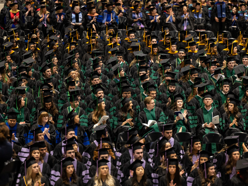 Wearing the colors of their fields of study, UMMC graduates await the start of commencement ceremonies.