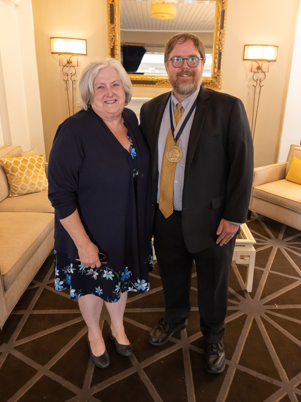 The first holder of the D. Jeanette Pullen Chair of Pediatric Hematology-Oncology, Dr. Gail Megason, congratulates Dr. Anderson Collier. Melanie Thortis/ UMMC Communications 