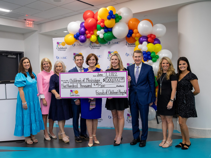 Celebrating a $500,000 donation from Friends of Children's Hospital are, from left, Suzanne Crell, UMMC major gifts officer; Meredith Aldridge, UMMC executive director of development; Teresa Matthews, Friends of Children's Hospital business manager; John Scarbrough, Friends board chairman; Dr. Mary Taylor, Suzan B. Thames Chair and professor of pediatrics; Kristin Allen, Friends chair-elect; Children's of Mississippi CEO Guy Giesecke; Leslie Campbell, Friends community relations and special events manager; and Mary Clair Kelly, Friends communications and marketing manager. Jay Ferchaud/ UMMC Communications