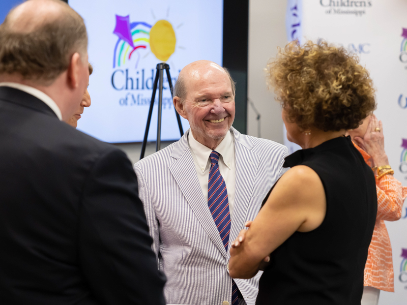 Smiling at the end of a six-year philanthropic effort, Joe F. Sanderson talks with Campaign for Children's of Mississippi Steering Committee members and supporters. Melanie Thortis/ UMMC Communications 