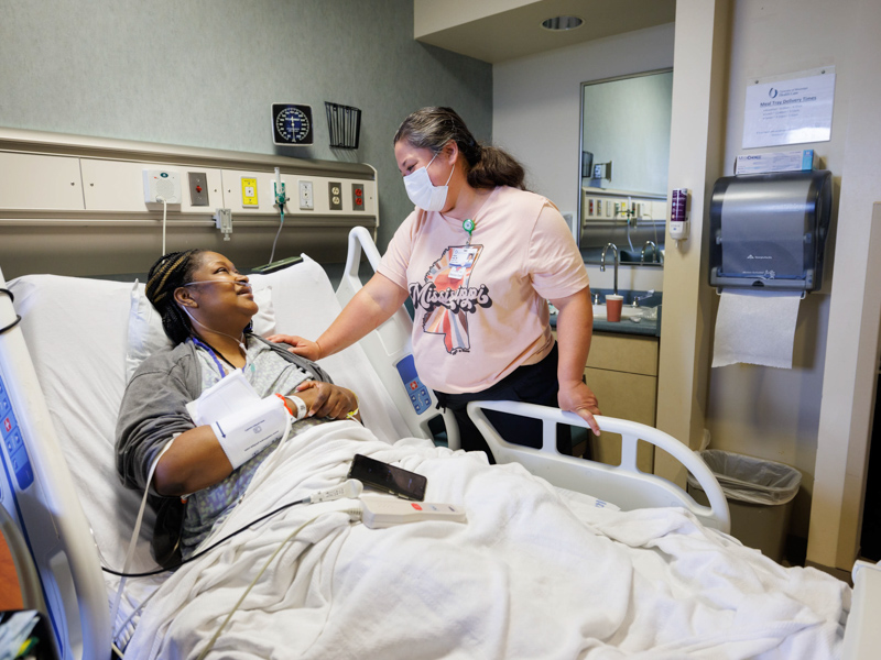 Transplant patient Tawanna Davis and Dr. Felicitas Koller visit the day before Davis was discharged from University Hospital. Koller on June 28 transplanted into Davis the live kidney of Davis' son, Quinten Hogan. Joe Ellis/ UMMC Communications 