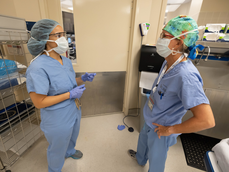 "I absolutely wanted to show enthusiastic young medical students what we do," says Dr. Mildred Ridgway, right, shown here with medical student Jessica McKenzie after directing a surgical procedure at Wiser Hospital. Melanie Thortis/ UMMC Communications