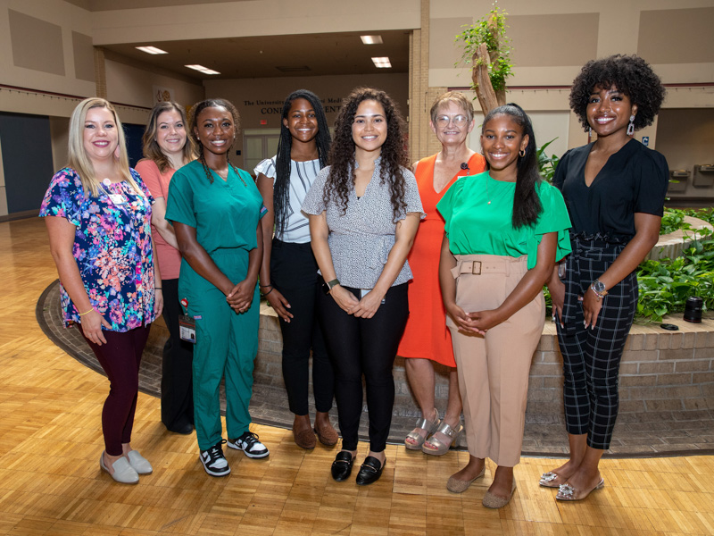 The five medical students chosen for the Oncology Summer Internship take a tour of oncology facilities at the Jackson Medical Mall on the first day of the program. From left are Michelle Devine, project administrator, hematology/oncology; Breanna Terrell, supervisor of business and clinical operations, hematology/oncology; students Daja Martin, Jayla Mondy and Jessica McKenzie; Dr. Stephanie Elkins; and students Kayla Beamon and Kenya Ashby. Jay Ferchaud/ UMMC Communications 