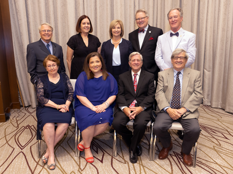 The night's honorees or their representatives, with Dr. LouAnn Woodward, back row, third from left, are, back row, from left: Hall of Fame inductees Dr. Richard deShazo; Dr. Leigh Neely, accepting for her late father, Dr. William "Gus" Neely; (Woodward); Dr. James Sones II; and Dr. Michael Brooks, accepting for his father, Dr. Thomas J. Brooks. Front row, from left, Dr. Helen Turner, Distinguished Medical Alumna; Dr. Laura Jackson Miller, Early Career Achievement Award winner; and Hall of Fame inductees Dr. Sandor Feldman and Dr. Joe Donaldson. Jay Ferchaud/ UMMC Communications 