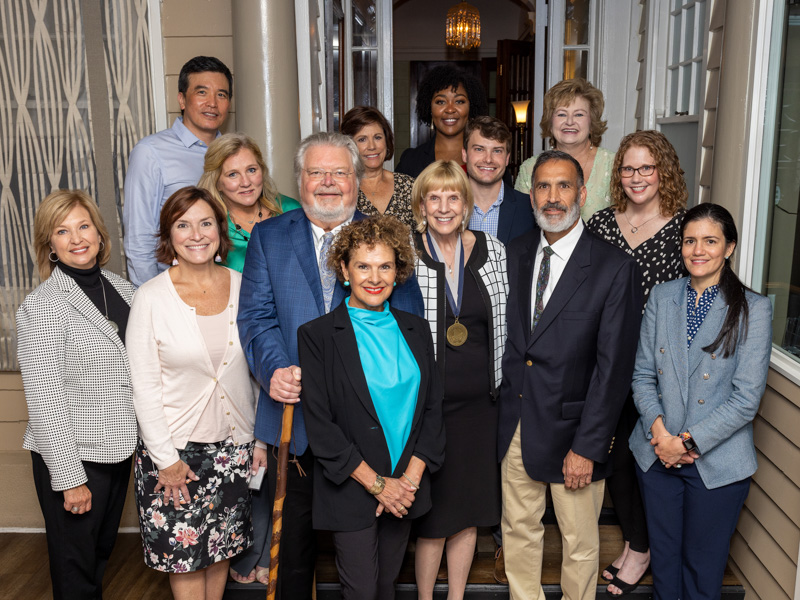 From left, Dr. LouAnn Woodward, vice chancellor for health affairs and dean of the School of Medicine, and Dr. Mary Taylor, Suzan B. Thames Chair and professor of pediatrics, congratulate Dr. Paul Parker and his wife, Kerry, and Dr. Phyllis Bishop, chief of the Division of Pediatric Gastroenterology, and her husband, Dr. Michael Nowicki, professor of pediatric gastroenterology, as well as the division team on the presentation of the Paul Parker Chair of Pediatric Gastroenterology. Jay Ferchaud/ UMMC Communications 