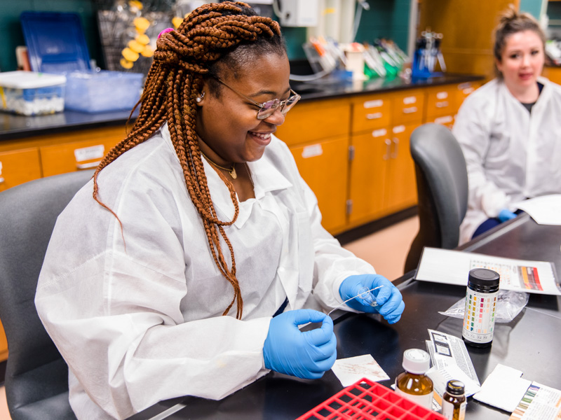 Medical Laboratory Science student Ty'Quasha Newell practices getting bodily fluid samples during a lab.