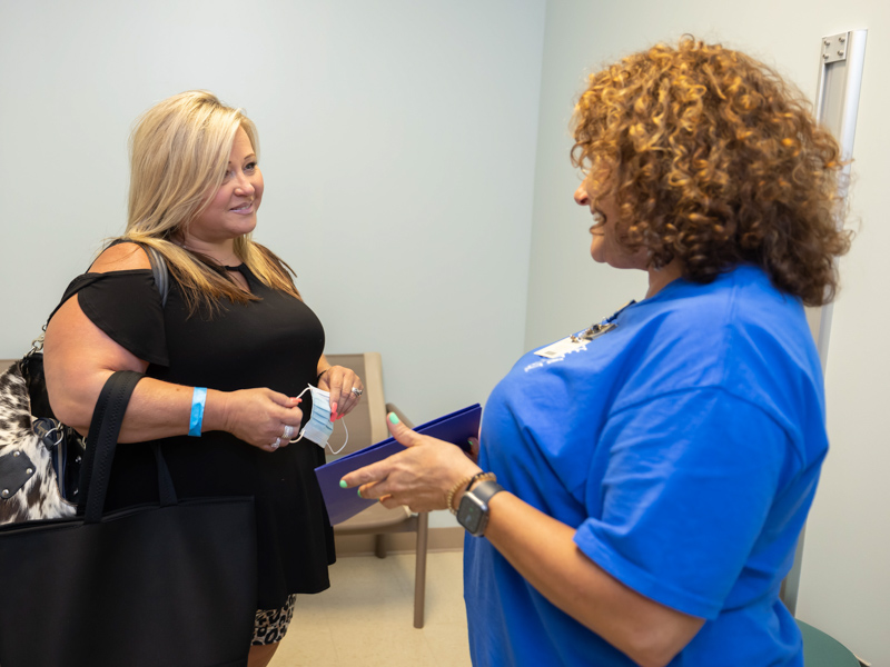 Mammography Lead Technologist Tammy Williams gives good news to patient Teresa Kemp during same-day consultation at the See, Test and Treat event held at the Jackson Medical Mall. Melanie Thortis/ UMMC Communications