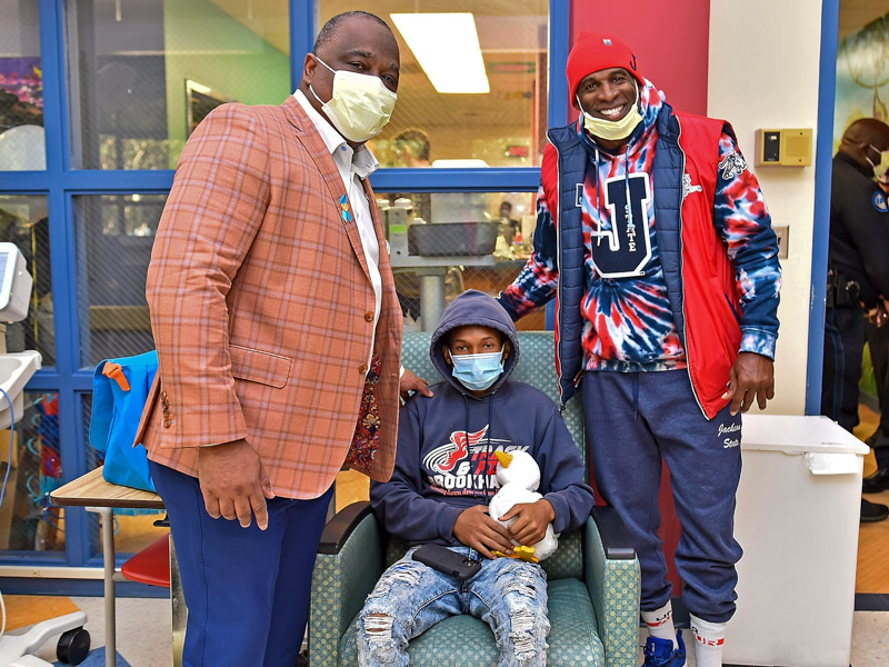 Virgil Miller, Aflac US President, welcomes the community during local event and announces delivery of 1,000 My Special Aflac Ducks to Children’s of Mississippi Hospital Cancer and Blood unit, alongside Coach Deion “Prime” Sanders and Buffy Swinehart, Senior Manager of Corporate Social Responsibility, Aflac on October 18, 2022 in Jackson, Mississippi. (Photo by Justin Ford/Getty Images for Aflac)