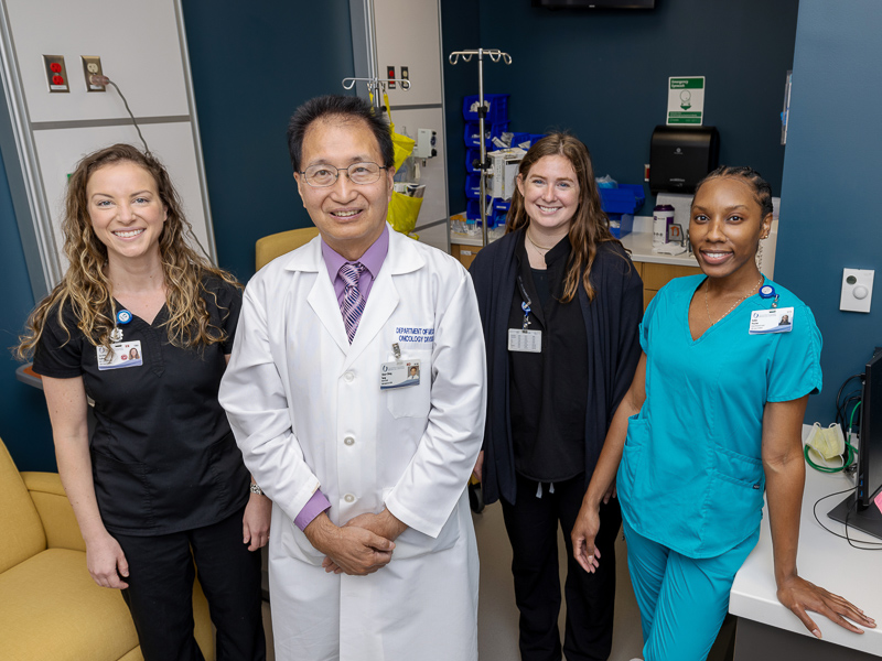 Dr. Tang, second from left, with his research team: nurse coordinator Jessica Solise, registered nurse Serena Flynt, and clinical research coordinator Robin Payton.