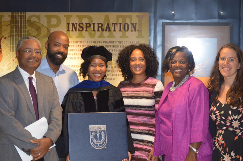 Dr. Gabrielle Banks is surrounded by her immediate family on the day she received her PhD from the University of Memphis. From left are her father, Fred Banks; brother, Jonathan Banks; (Gabrielle Banks); sister, Dr. Rachel Banks; mother, Dr. Pamela Banks; and sister-in-law, Bethany Owens Banks.