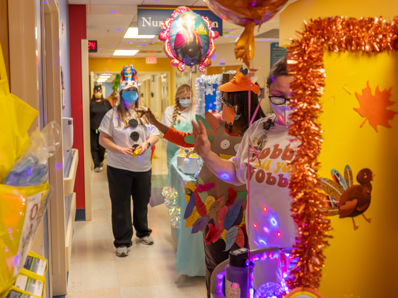 Children's of Mississippi's child life team wave to patients during the hospital's annual Thanksgiving Parade. From left are Courtney Easterday, Anne Elizabeth Zegel, Michelle Chambers and Ashley Prendez. Melanie Thortis/ UMMC Communications