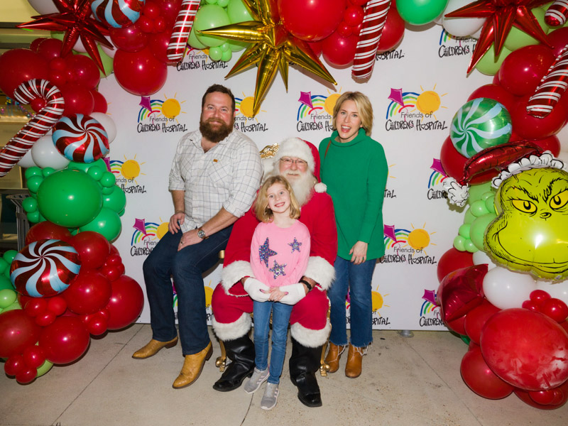 HGTV stars Ben and Erin Napier and daughter Helen visit with Santa during BankPlus Presents Light-A-Light. Joe Ellis/ UMMC Communications