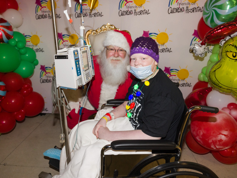 Santa smiles with Children's of Mississippi patient Ella Spinks of Collinsville during BankPlus Presents Light-A-Light. Joe Ellis/ UMMC Communications