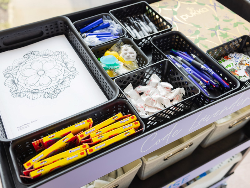 The Office of Well-being has created a Code Lavender cart supplied with chocolate and other goodies that can be transported to floors or departments where employees need a pick-me-up. Melanie Thortis/ UMMC Communications 