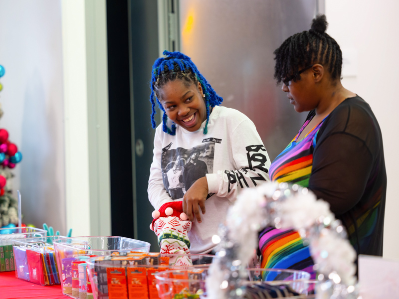 Children's of Mississippi patient Fe'Leia Taylor of Jackson smiles at her mom, Freida Taylor, during their visit to Santa's Workshop. Melanie Thortis/ UMMC Communications
