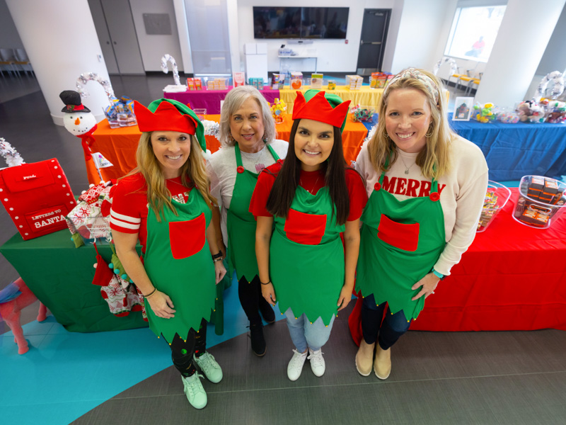 Santa's Workshop had helpers including, from left, Friends of Children's Hospital Community Relations and Special Events Manager Leslie Owens, Business Manager Teresa Matthews, Communications and Marketing Manager Mary Clair Kelly, and Jill Dale, a Friends of Children's Hospital board member. Melanie Thortis/ UMMC Communications
