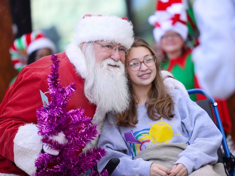 Santa smiles for a photo with Lillian Evans of Lumberton during BankPlus Presents Winter Wonderland at Children's of Mississippi. Melanie Thortis/ UMMC Communications 