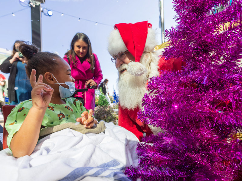 Children's of Mississippi patient Emoni Course of Jackson has a visit with Santa Claus during BankPlus Presents Winter Wonderland. Melanie Thortis/ UMMC Communications 