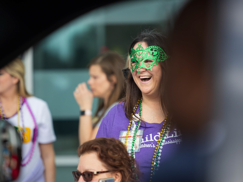 Child Life Specialist Pepper Weed-Cooper is all smiles during the Mississippi Department of Public Safety Mardi Gras parade Melanie Thortis/ UMMC Communications 