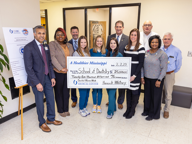 From left, Dr. Sreenivus Koka, dean of the School of Dentistry, JoAnna McDaniel, financial center leader at Hancock Whitney, Adam Cox, commercial banker at Hancock Whitney, dental students Mary Claire Whitehead, Maggie Smith and Anna McDowell, Leigh Pace, Jackson market president at Hancock Whitney, Melissa Peters, commercial banker at Hancock Whitney, Dr. Scott Phillips, SOD assistant dean, Melody Longino, manager of ambulatory operations and Steve Moseley, director of ambulatory operations.