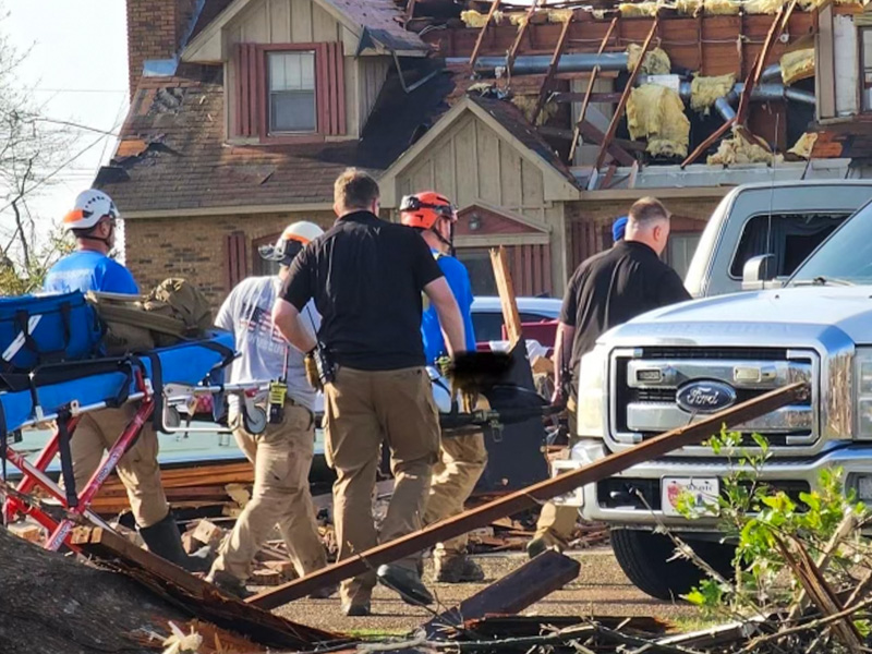 During the 2023 Rolling Fork tornado disaster, Will Appleby, centered in front with a black shirt, along with his supervisor Jeremy Benson, provided assistance with emergency management, injuries, recovery and logistics during the aftermath of the storm.