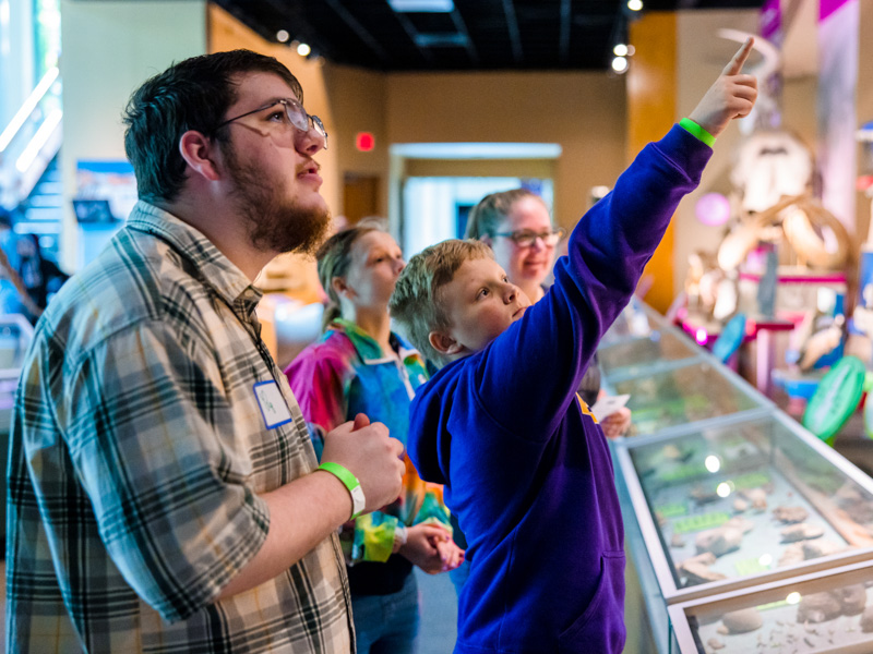 Children's of Mississippi patient Brandon Stouder, with brother Kasen, sister Sunshine and mother Paulie, takes in one of the exhibits at the Mississippi Museum of Natural Science.