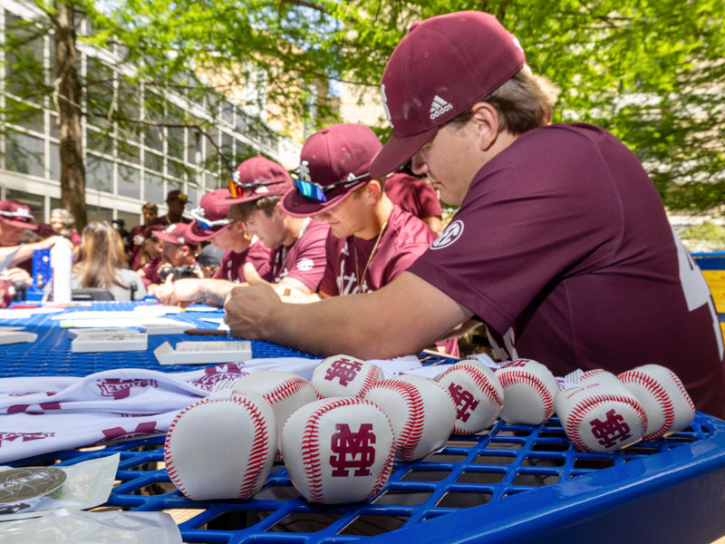 Mississippi State baseball players color and sign autographs during a visit to Children's of Mississippi's Rainbow Garden. Jay Ferchaud/ UMMC Communications