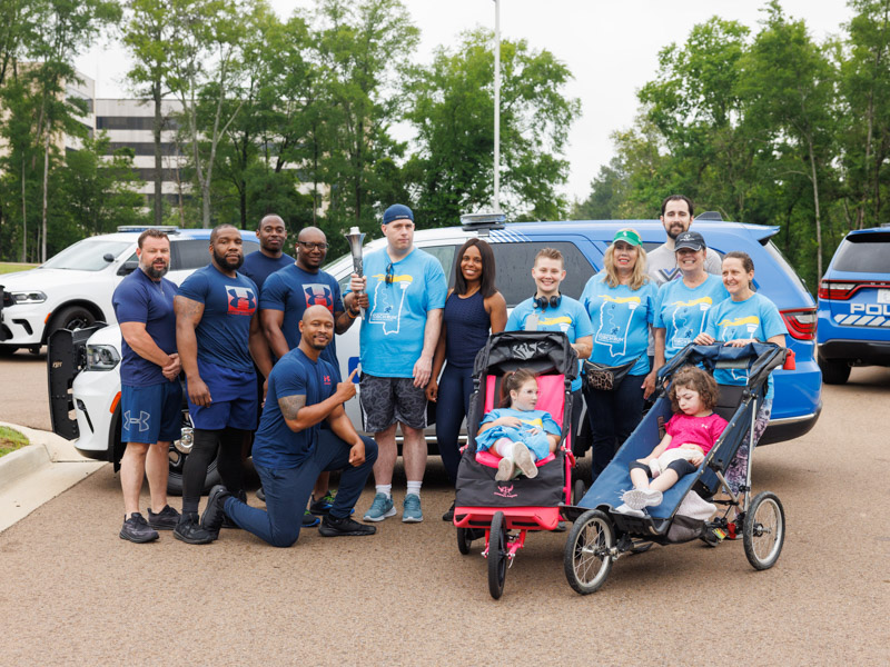 From left, Capitol Police investigator Shaun McDaniel, Capitol Police officers Jamal Watkins, Justin Haralson, Matthew Johnson, Chauncy Webster (kneeling), Brendan Leahy, Capitol Police officer Catherine Collins, UMMC Police Sgt. Toni Sumrall, Susan Leahy, UMMC Police Capt. Nick Kehoe, UMMC Police Chief Mary Paradis, UMMC Police Detective Beth Victoriano, Sami-Jo Hardy, Elizabeth Guy