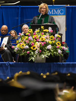 Vice Chancellor for Health Affairs and Dean of the School of Medicine Dr. LouAnn Woodward addresses graduates during commencement ceremonies.