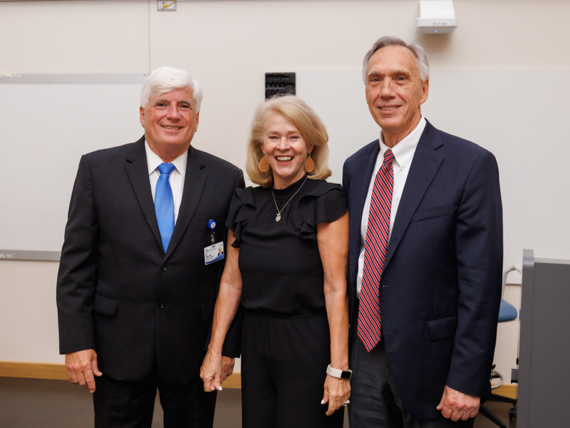 Granger and wife Linda celebrate his retirement with his former mentor, Dr. John Hall. Joe Ellis/ UMMC Communications 