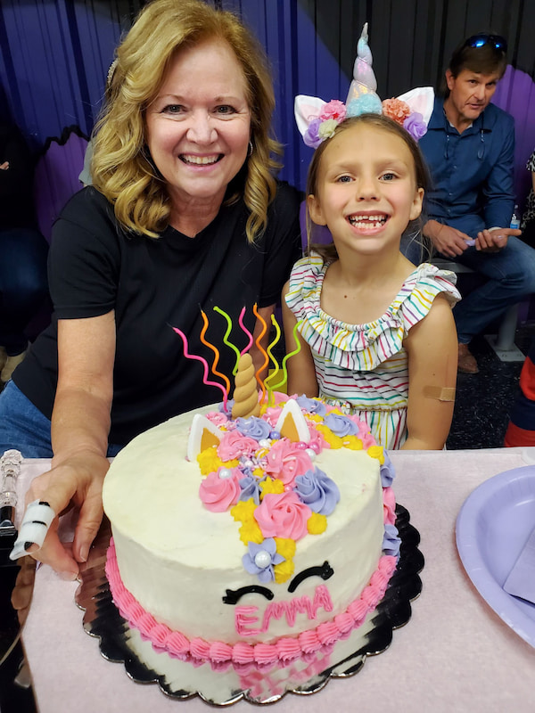 Judy Herrington enjoys spending time with her three grandchildren, including cake-designing with granddaughter Emma Doherty.