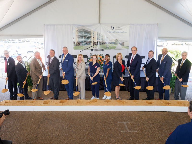 Martin, sixth from left, helps break ground on a new home for the UMMC School of Nursing in June 2023. Joe Ellis/ UMMC Photography 