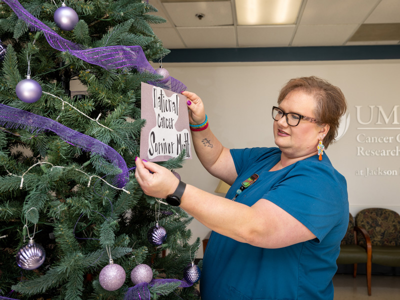 Each month, Shannon Strong takes the lead on decorating the lobby tree which has become a beacon of cancer awareness, support and hope for cancer patients and survivors who visit the Cancer Center and Research Institute.