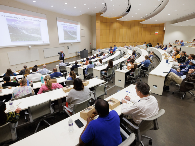 A School of Medicine lecture hall is the setting for Dr. Darrell Kirch's lecture on well-being.