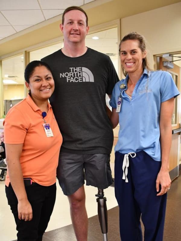 On a visit to Methodist Rehab after receiving his prothesis, Matt Branch is greeted by physical therapist Veronica Taylor, left, and occupational therapist Melissa Kaye McCombs who was working at Methodist Rehab at the time. (Photo courtesy of Dr. Hyung Kim and Methodist Rehab)