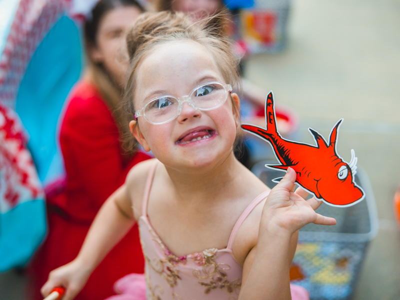 Berkeley Foster, daughter of Penni Foster, associate chief student affairs officer in Family Medicine, smiles with her goldfish during Spooky U.